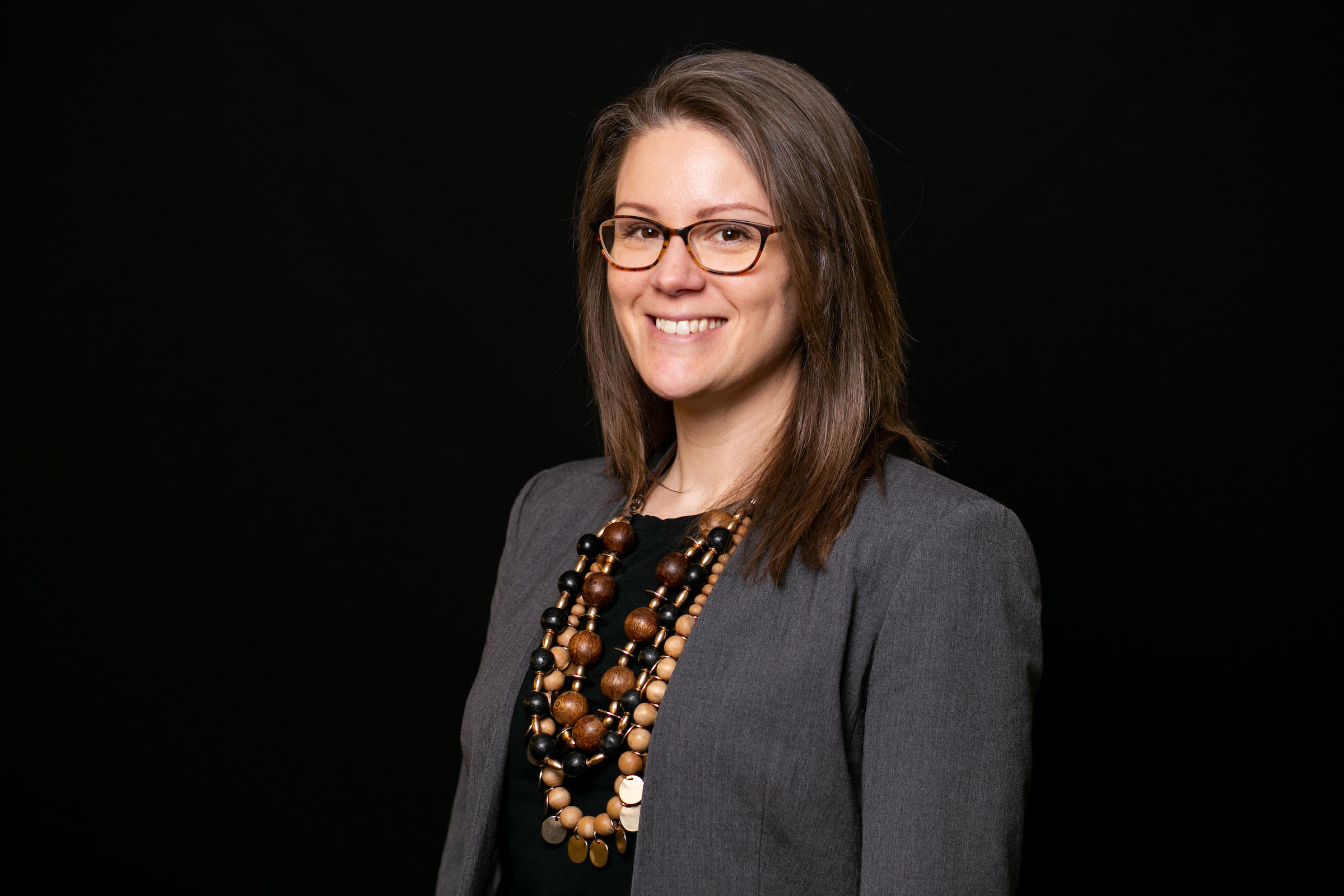 woman in front of black background